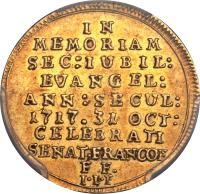 obverse of 1 Dukat - Bicentennial of the Reformation (1717) coin with KM# 184 from German States. Inscription: IN MEMORIAM SEC:IUBIL: EVANGEL: ANN : SECUL: 1717.31 OCT: CELEBRATI SENAT.FRANCOF F F. I.I.F