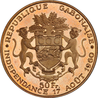 reverse of 50 Francs - Independence (1960) coin from Gabon. Inscription: REPUBLIQUE GABONAISE 50 Fr. INDEPENDANCE 17 AOÛT 1960